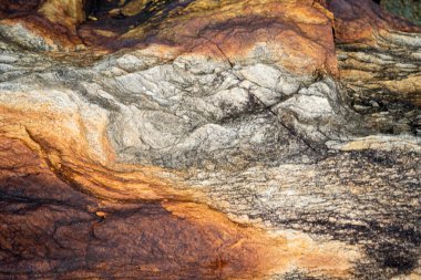 Kırsal taşlar, paslanmış dokular, renkli ve ilginç arka planlar ve büyüleyici dokular, web tasarımı ve soyut arkaplanlar için kullanılır.