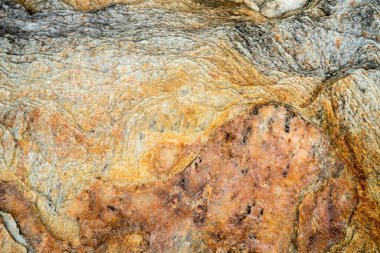 Kırsal taşlar, paslanmış dokular, renkli ve ilginç arka planlar ve büyüleyici dokular, web tasarımı ve soyut arkaplanlar için kullanılır.