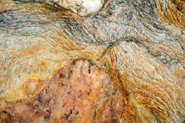 Kırsal taşlar, paslanmış dokular, renkli ve ilginç arka planlar ve büyüleyici dokular, web tasarımı ve soyut arkaplanlar için kullanılır.