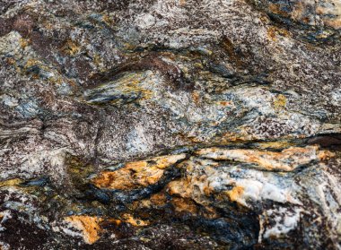 Kırsal taşlar, paslanmış dokular, renkli ve ilginç arka planlar ve büyüleyici dokular, web tasarımı ve soyut arkaplanlar için kullanılır.