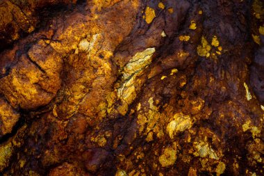 Kırsal taşlar, paslanmış dokular, renkli ve ilginç arka planlar ve büyüleyici dokular, web tasarımı ve soyut arkaplanlar için kullanılır.