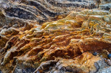 Kırsal taşlar, paslanmış dokular, renkli ve ilginç arka planlar ve büyüleyici dokular, web tasarımı ve soyut arkaplanlar için kullanılır.