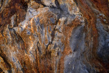 Kırsal taşlar, paslanmış dokular, renkli ve ilginç arka planlar ve büyüleyici dokular, web tasarımı ve soyut arkaplanlar için kullanılır.