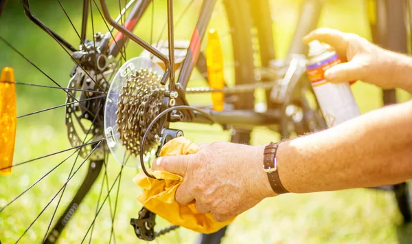 Senior Man Hand Cleaning Bike Spray Rag Doing Maintenance His — Stockfoto