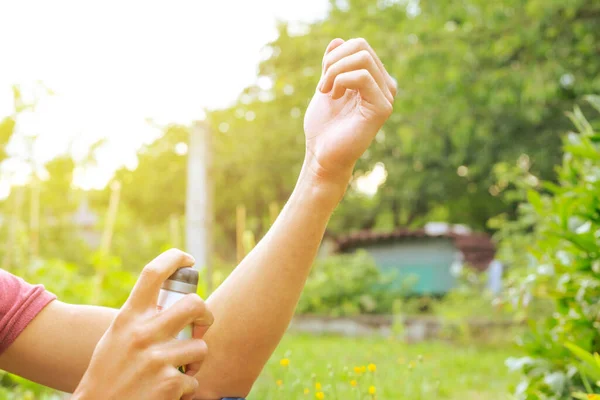 Young Man Spraying Repellent Some Kind Insects Healthcare Concept — стоковое фото