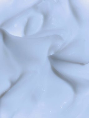close-up texture of white cosmetic cream. Creamy skincare lotion mousse product closeup