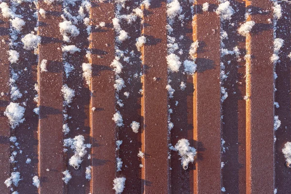 Brown Metal Fence Illuminated Winter Sun Frost Adhered Snow Flakes — 图库照片