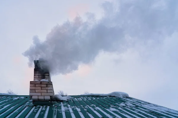 Thick Smoke Comes Brick Chimney Roof House Gray Sky Green — Foto de Stock