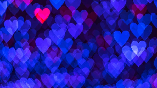 黒を背景に青とピンクのハートを持つボケの背景 愛の概念 バレンタインデーのテーマ 高品質の写真 — ストック写真