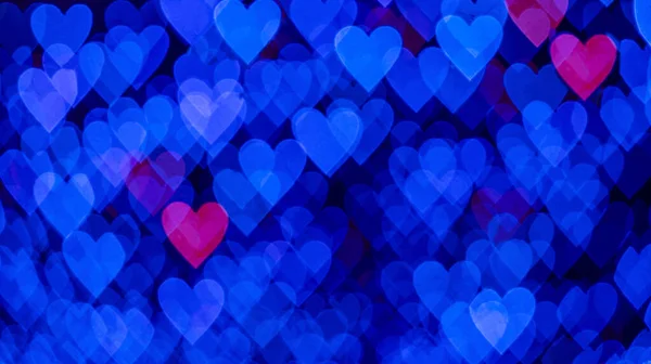 黒を背景に青とピンクのハートを持つボケの背景 愛の概念 バレンタインデーのテーマ 高品質の写真 — ストック写真