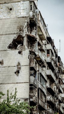 Irpin, Ukraine - May 22, 2022: the consequences of the aggression of the Russian army: shot, bombed, burned apartments and houses. High quality photo.
