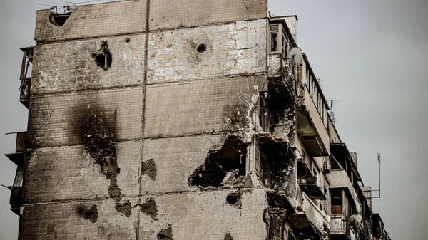 Irpin, Ukraine - May 22, 2022: the consequences of the aggression of the Russian army: shot, bombed, burned apartments and houses. High quality photo.