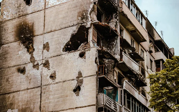 Irpin, Ukraine - May 22, 2022: the consequences of the aggression of the Russian army: shot, bombed, burned apartments and houses. High quality photo.