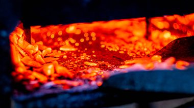 Hot coals in the grill, background, glowing coals in the background, mid view. High quality photo.
