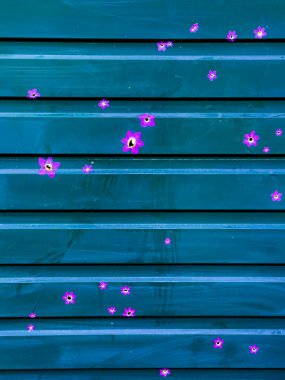 Shot holes in the fence are painted over. The concept of restoration and rehabilitation after the war of occupation. High quality photo.