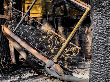 Bucha, Ukraine - May 22, 2022: destroyed facade of the house due to the impact of a Russian projectile. Racism. War in Ukraine. Destruction of civilian buildings. High quality photo.