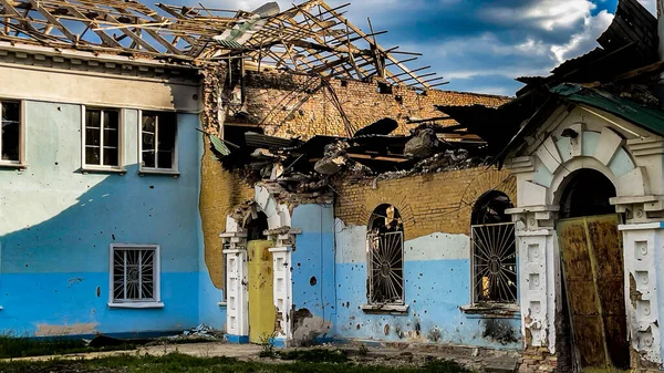 Irpin, Ukraine - May 22, 2022: the facade of the bombed-out building of culture. The concept of destruction of civil infrastructure during occupation, war. Racism.