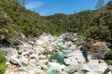 The Yuba River in California and its rocky bed.