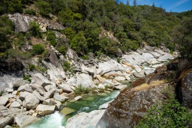 The Yuba River in California and its rocky bed.