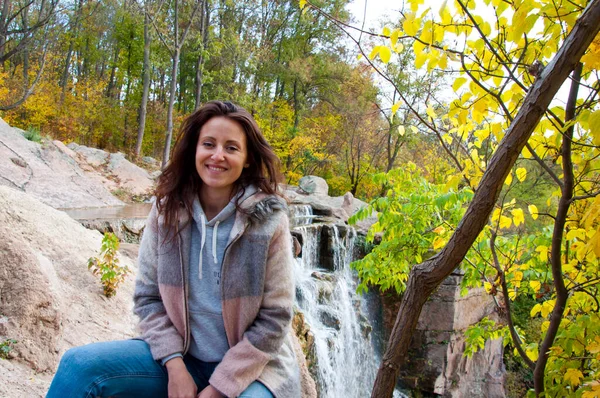 Autumn Nature Copy Space Cheerful Woman Coat Sitting Waterfall — Stock Photo, Image