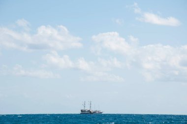 ship and boat on sky backdrop. summer travel and vacation.