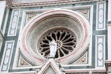 Exterior rose window of Florence Cathedral Duomo architectural detail in Italy.