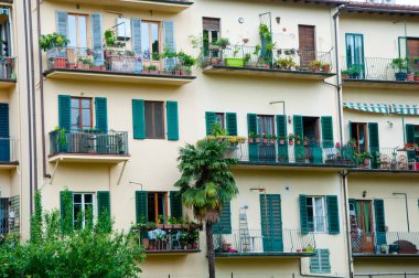 Apartment building facade exterior architecture in Florence, Italy.