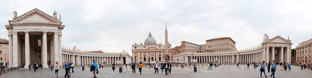 Panorama of Saint Peters Square with Saint Peters Basilica tourist attraction in Rome, Italy.