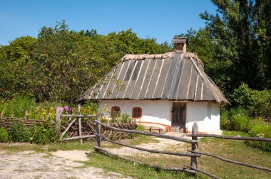 Authentic old village thatched hut folk architecture in ethnographic open-air museum in Pyrohiv, Ukraine.