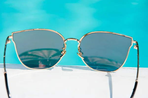 summer sunglasses at swimming pool. summer holiday and vacation. summer pool party.