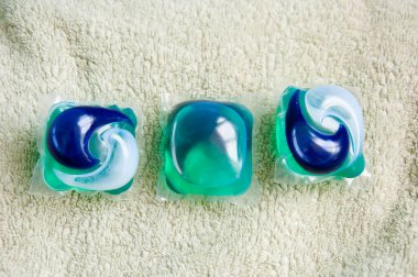 detergent pods on towel. minimalism of detergent. laundry detergent. flat lay.