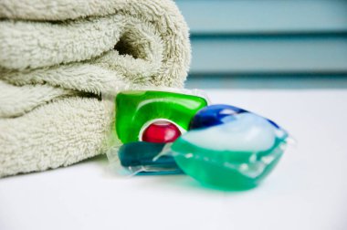 laundry detergent. towel and laundry pods. household and laundry.