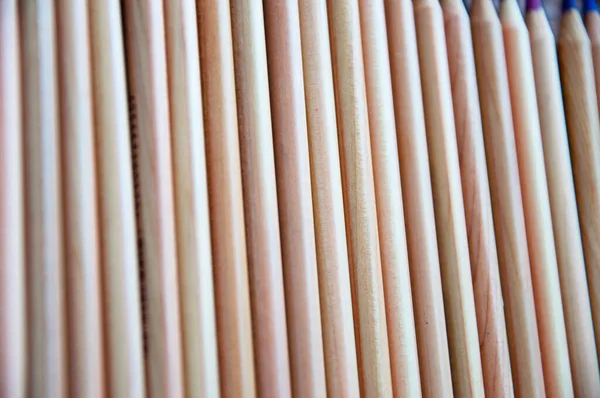 wooden pencil background. backdrop of wood pencil. stationery set. selective focus.
