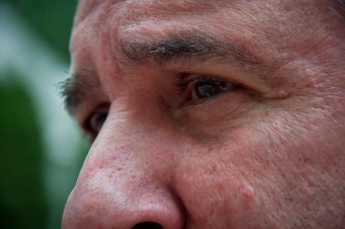 senior man eyes looking. cropped view of face.