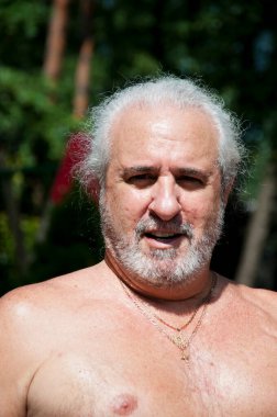 senior cuban man enjoying summer vacation and suntan.