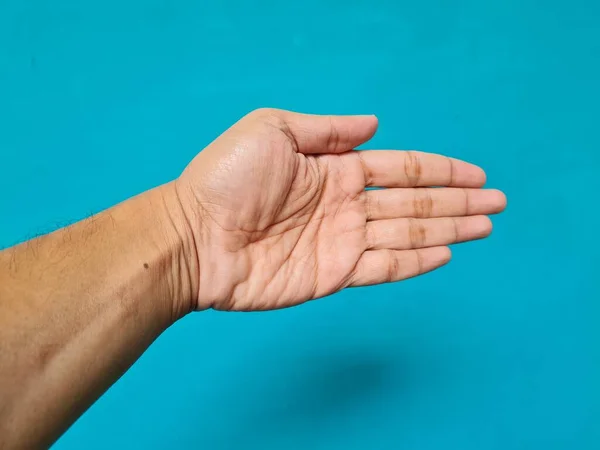Ludzka Ręka Brązowy Niebieski Tło — Zdjęcie stockowe