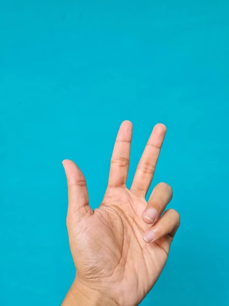 Human Hand Brown Blue Background — Stock Photo, Image