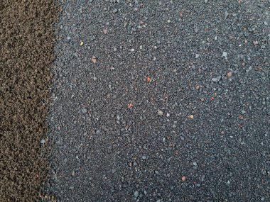 Yapı kumunun iki rengi olan soyut dokularının arka planı, yani siyah ve gri.