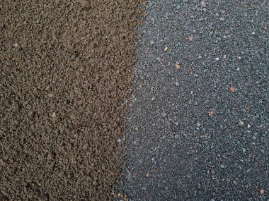 Yapı kumunun iki rengi olan soyut dokularının arka planı, yani siyah ve gri.