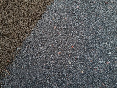 Yapı kumunun iki rengi olan soyut dokularının arka planı, yani siyah ve gri.