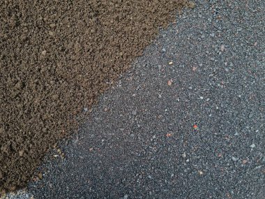 Yapı kumunun iki rengi olan soyut dokularının arka planı, yani siyah ve gri.