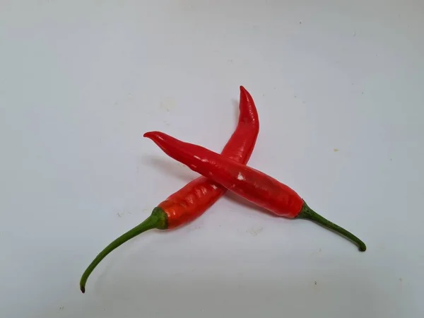 Big Red Chili Green Handle White Background Chili Usually One — стоковое фото