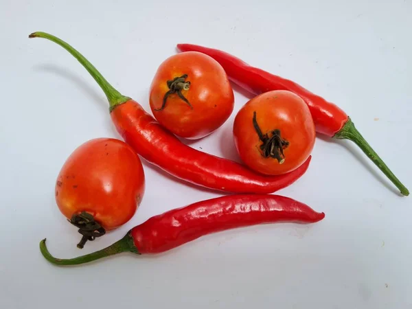 Big Red Chilies Green Handles Big Red Chilies White Background — стоковое фото