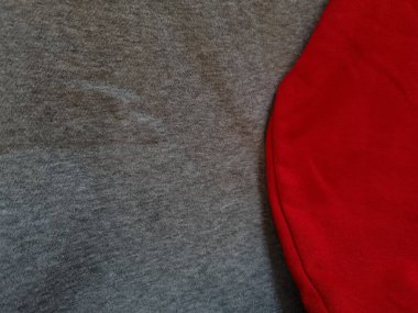 Soyut kumaş arka plan. Gri giysiler kırmızı ile birleştirilmiş.