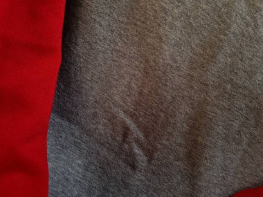 Soyut kumaşın arkaplan fotoğrafı. Gri desenli ve kırmızı ile birleştirilmiş.