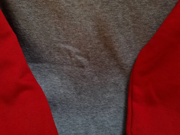 Soyut kumaş arka plan. Gri giysiler kırmızı ile birleştirilmiş.