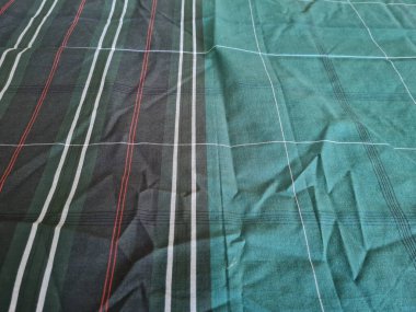 Yeşil sarong desenli soyut arkaplan ve bir kutu oluşturmak için satır kombinasyonu