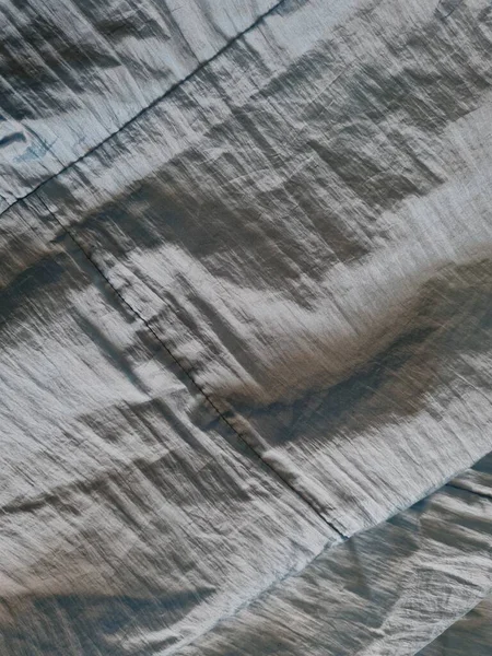 Abstract Background Textured Shiny Light Blue Fabric Irregular Creases Shadows — Stock Photo, Image