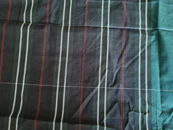 Yeşil sarong desenli soyut arkaplan ve bir kutu oluşturmak için satır kombinasyonu