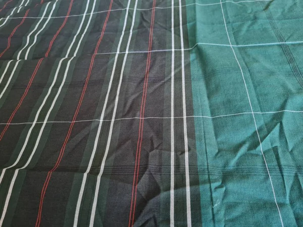 Yeşil sarong desenli soyut arkaplan ve bir kutu oluşturmak için satır kombinasyonu